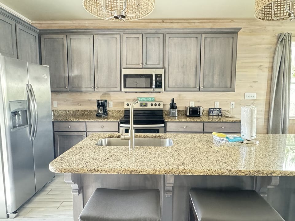 This home has an open floor plan that connects the living room, dining room, and kitchen.