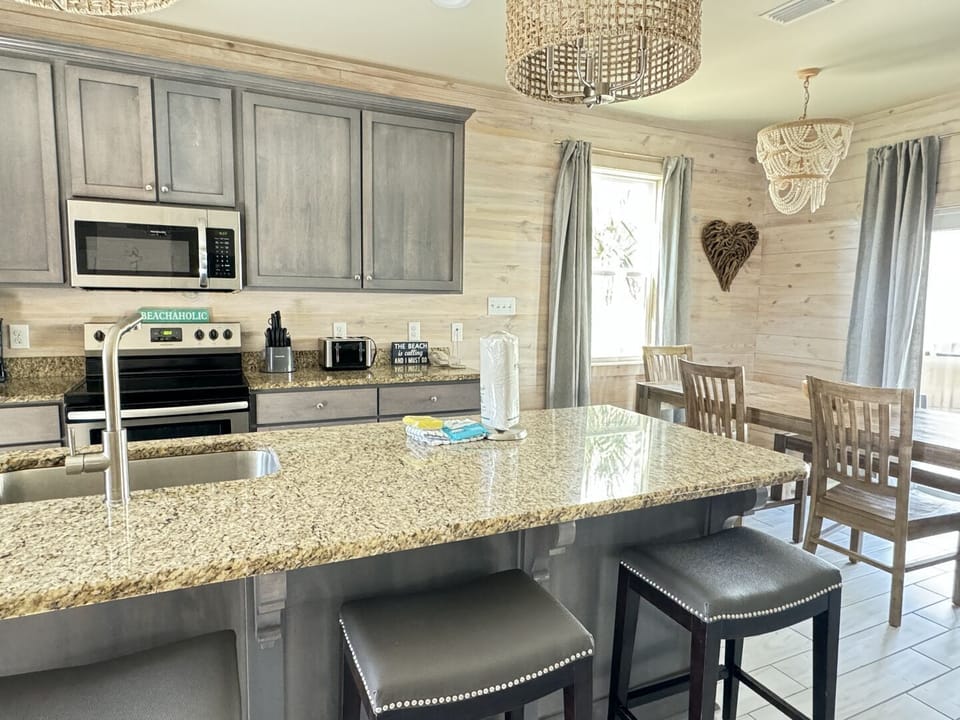 This home has an open floor plan that connects the living room, dining room, and kitchen.