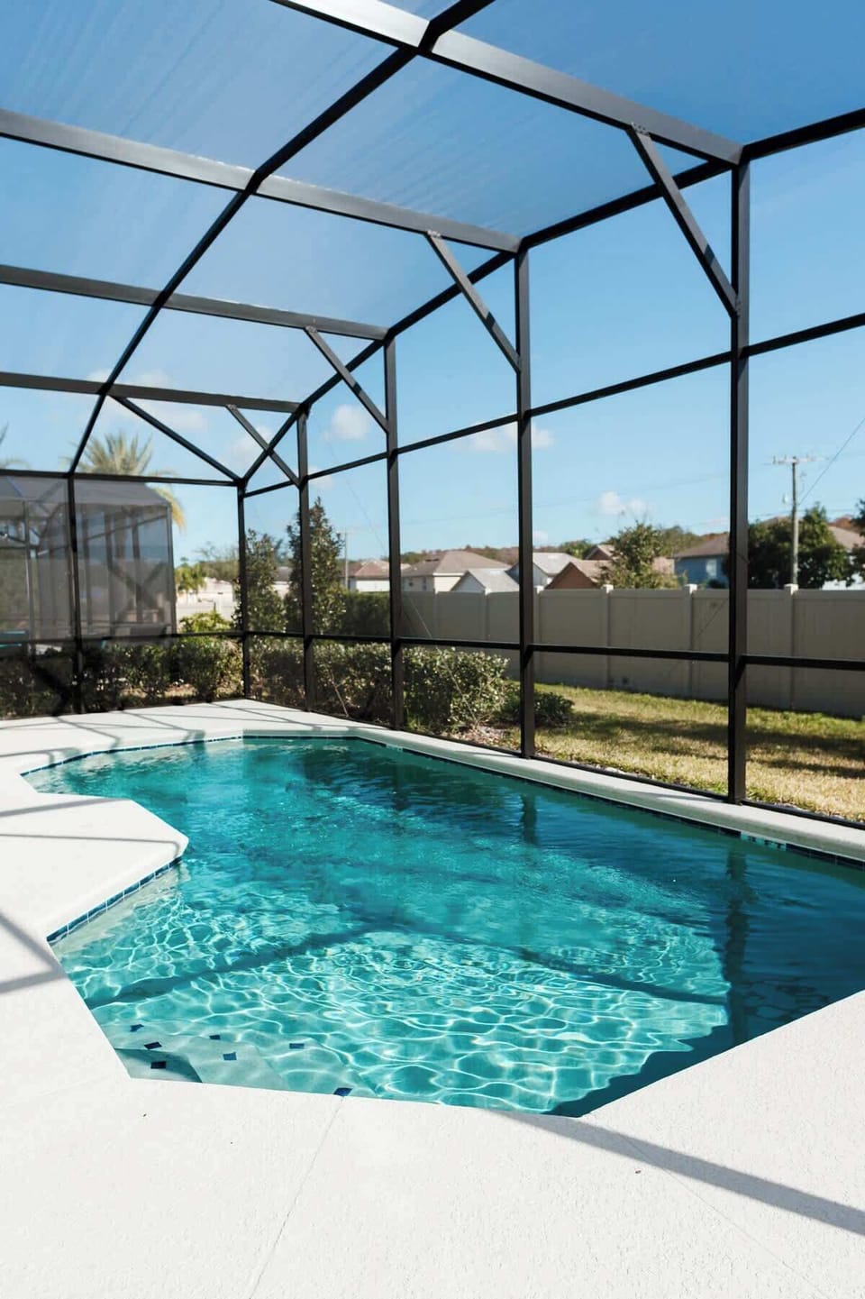 Private screened pool with sparkling water — enjoy sunny Florida days just minutes from Disney