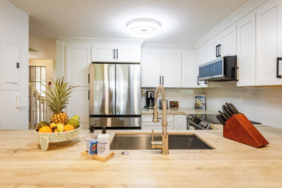The kitchen is fully stocked with all the essentials for preparing meals.