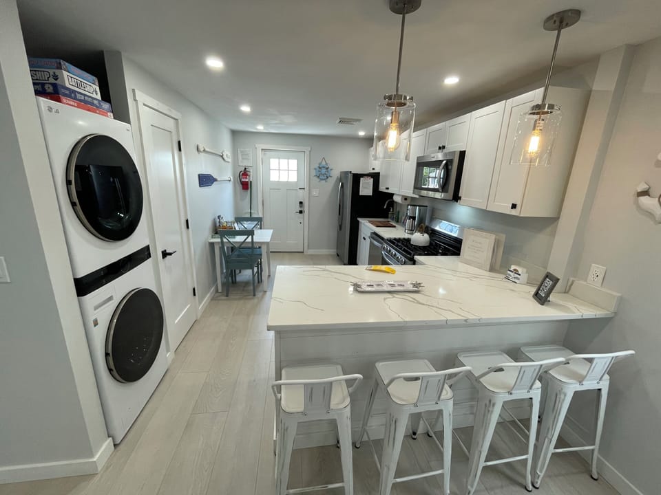 Fully equipped kitchen with stainless steel appliances, Washer and Dryer.