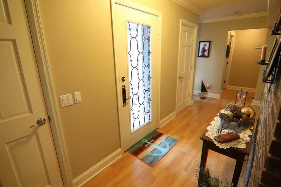 Welcome to the front entrance of the home, leading to the living room. 