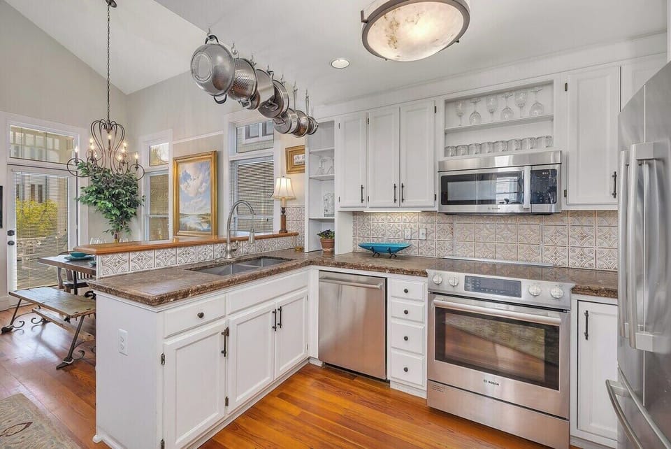Alternate view of the kitchen with view of the dining table