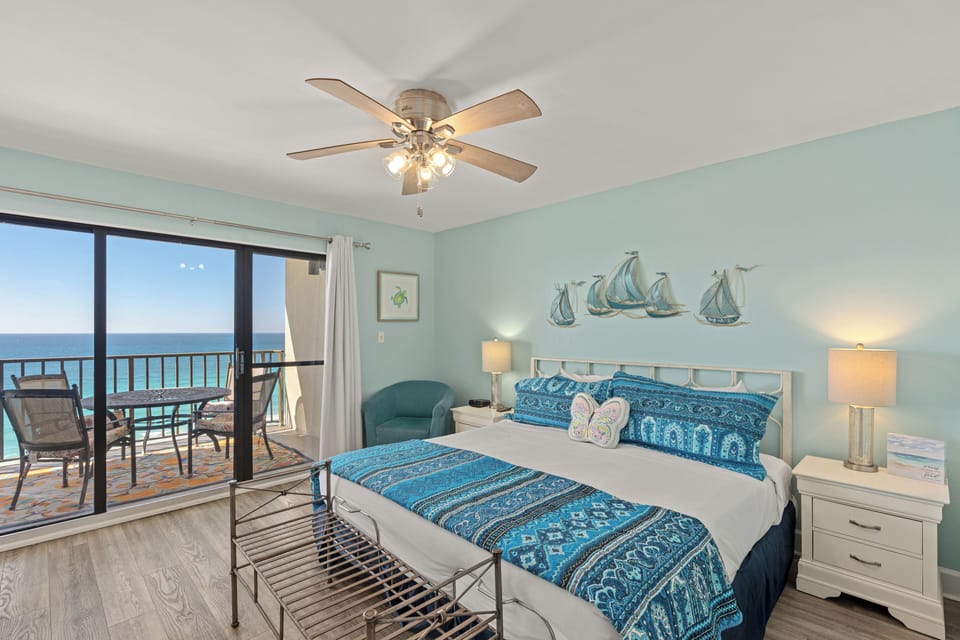 Primary bedroom features a king bed and balcony access.