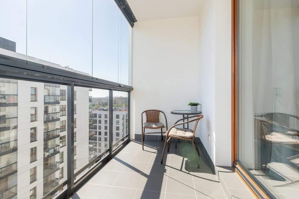 Furnished balcony with dining area.