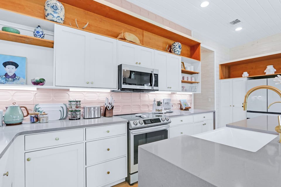 The kitchen is fully stocked with all appliances