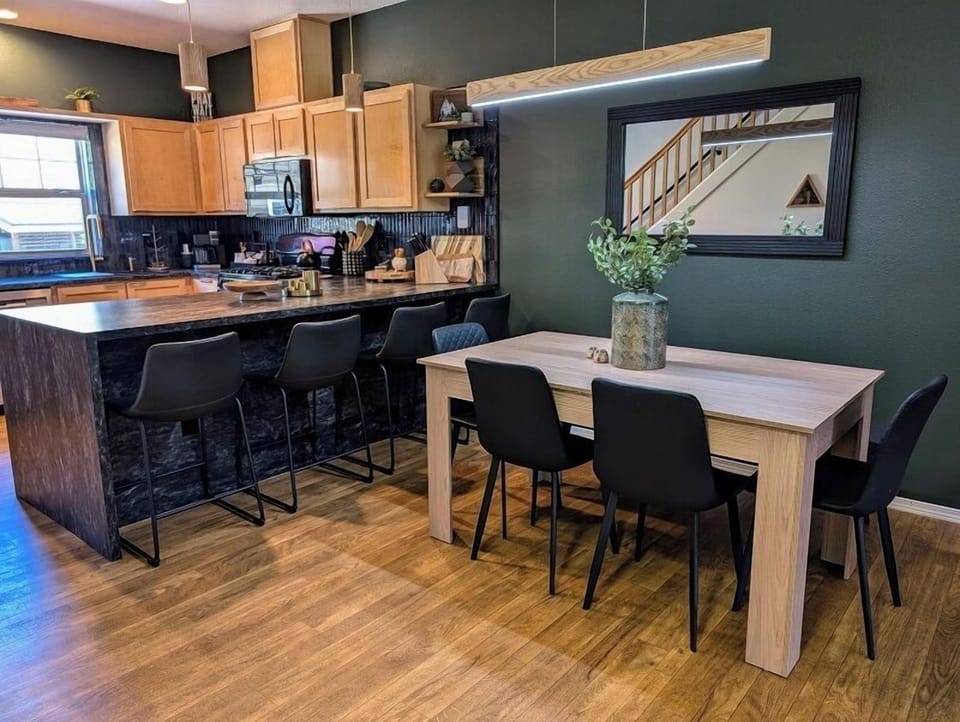 Large breakfast bar with 4 comfy stools and dining table with 6 chairs.