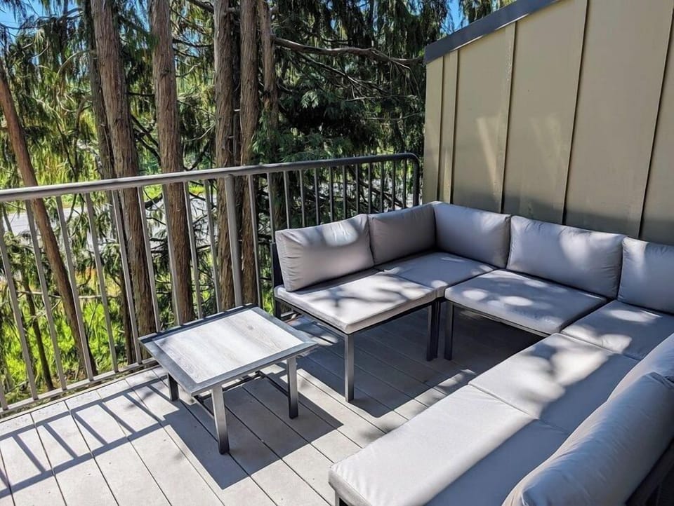 Large outdoor couch on back deck.