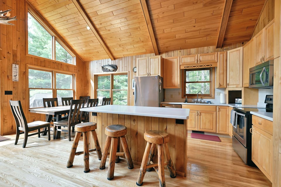 The updated kitchen/dining area has brand new counters, flooring, and furniture.
