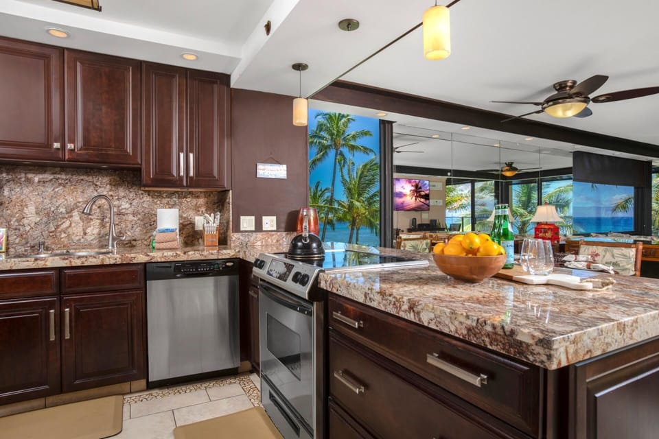   This kitchen gleams like a well-polished secret, where stainless steel appliances flirt with rich cherrywood charm  