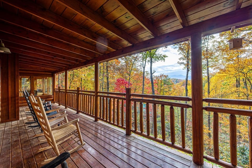Relax with this mountain view from our spacious decks. Ample seating awaits on our cabin's decks, offering the perfect vantage point to soak in the serene beauty of the Smoky Mountains.