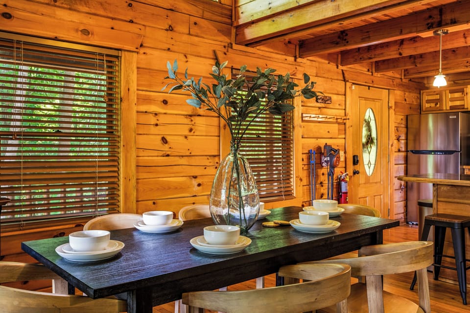 Dine in style at our elegant table, featuring a chic centerpiece and comfortable chairs, perfect for memorable meals.