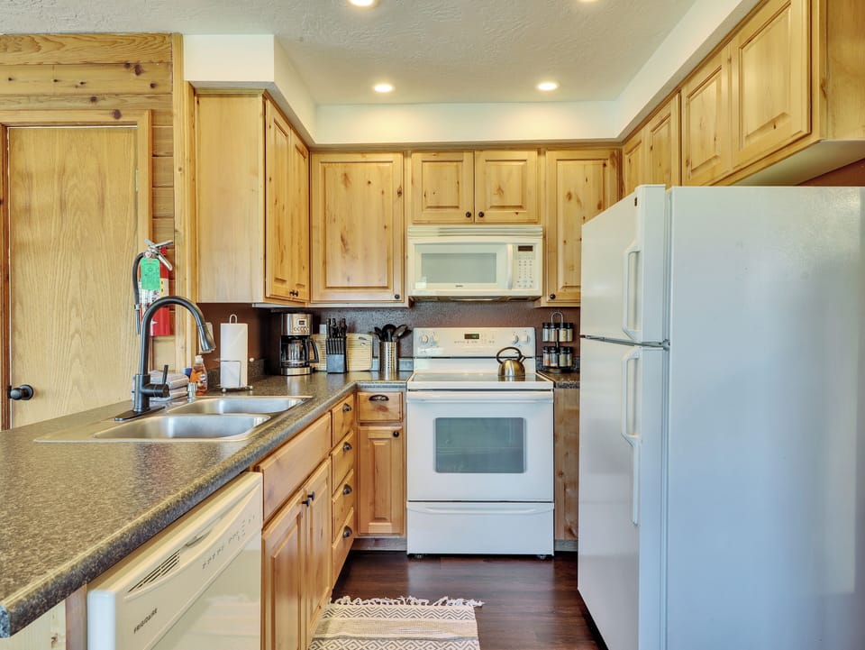 Fully loaded kitchen with, dishwasher, stainless steel sink, microwave, stove and oven