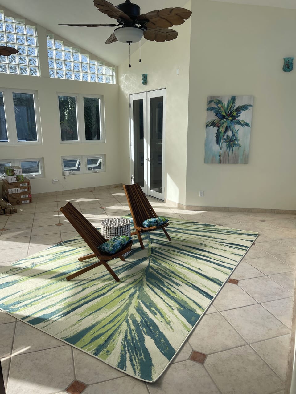 Foyer going out to the pool and in between kitchen and upstairs guest bedrooms
