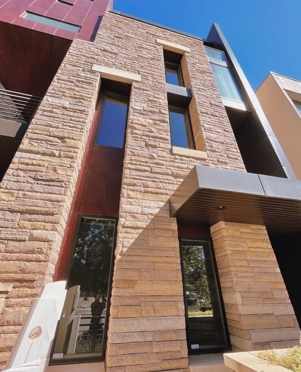 Unique, modern townhouse with stunning architecture, original sculpture and art.