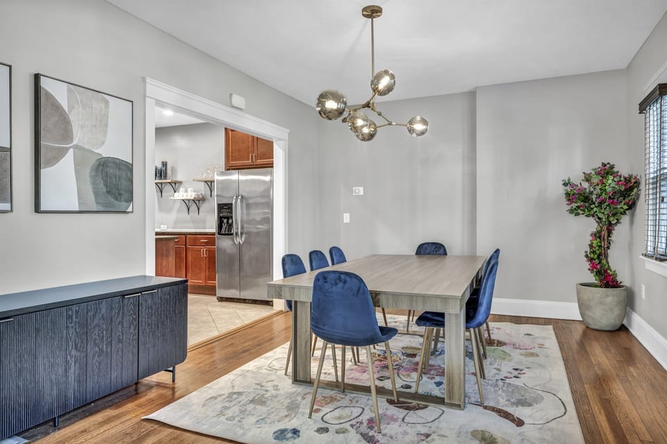 The dining room and kitchen are designed to flow together perfectly, offering an open, airy space for cooking, dining, and entertaining.