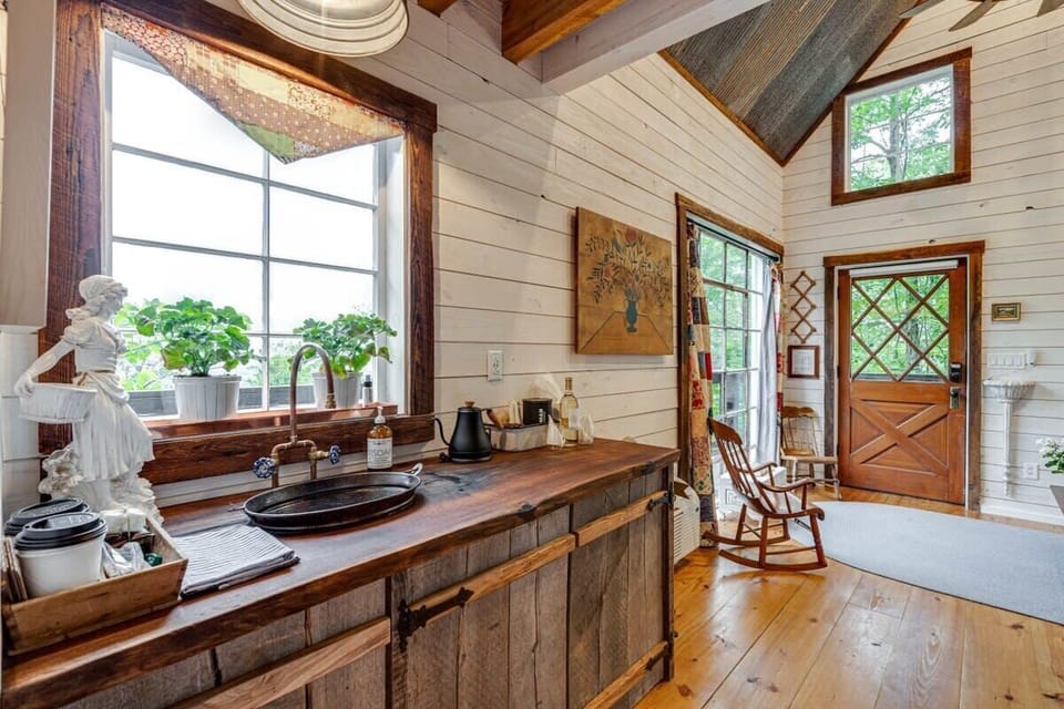 The kitchenette with custom counters and hammered copper sink