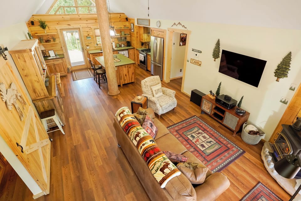 View of living room/ kitchen from the living room loft! 