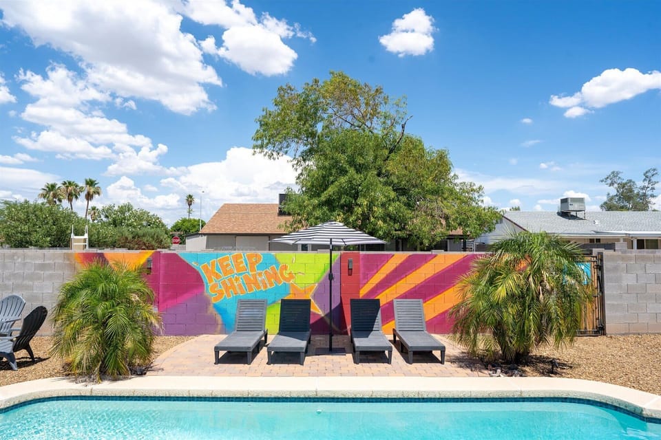 Enjoy poolside comfort under our stylish umbrella on lounge chairs