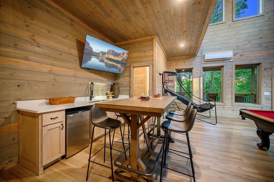 Enjoy the game on the TV or grab a drink from the built in wet bar