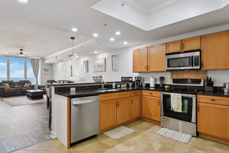 Full kitchen includes fridge w ice & water, dishwasher, oven range, microwave, pantry, disposal, etc.