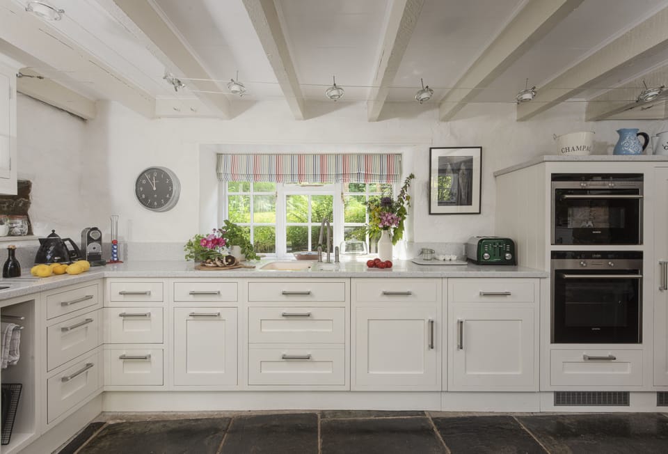 The Watermill, Withiel: The beautifully finished kitchen is complete with a double electric oven, induction hob, microwave, fridge with ice box, dishwasher, washer/dryer and a Nespresso coffee machine