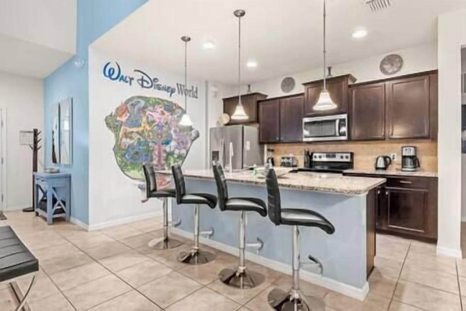Full kitchen with all necessary cookware and dining ware.