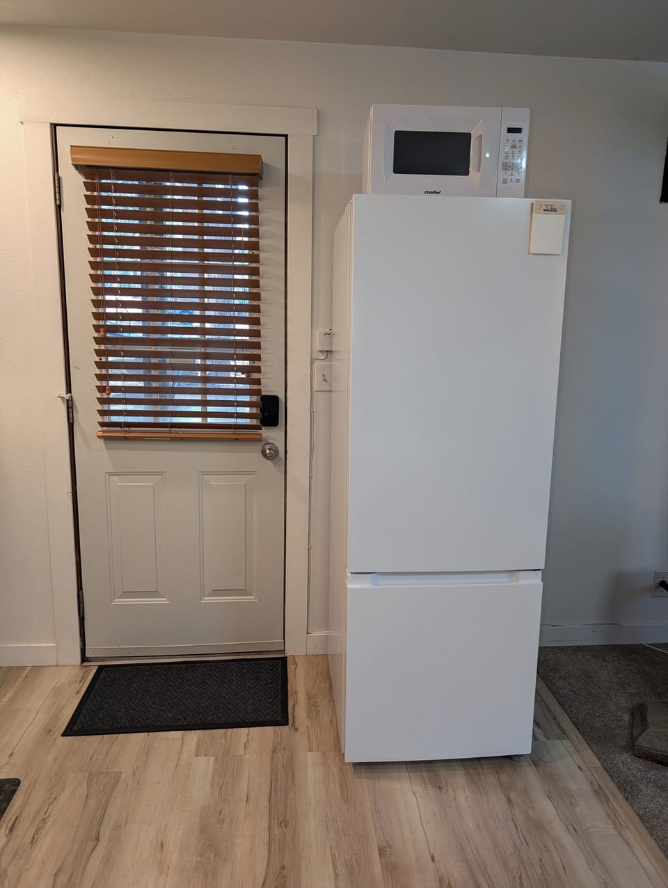Full size refrigerator freezer and new microwave.    