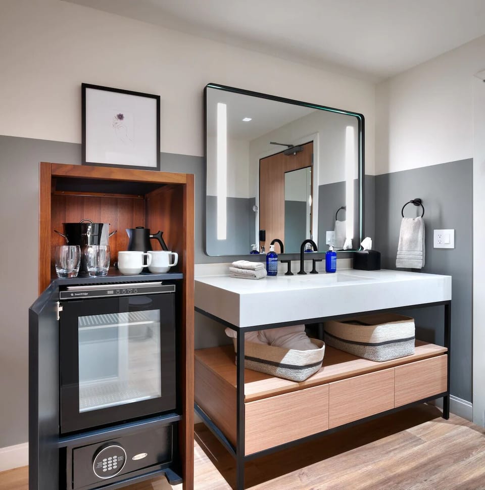 Sip morning coffee with an in-room fridge and essentials.