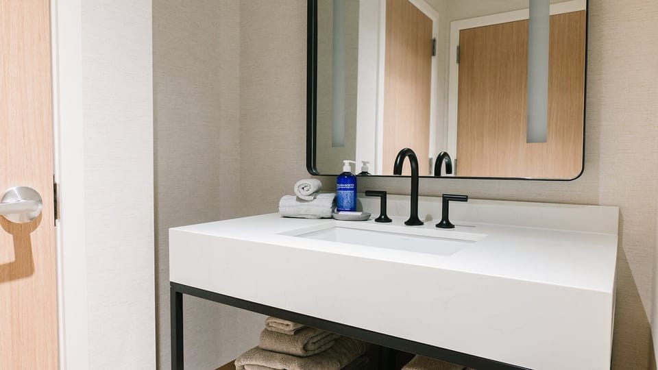 Enjoy a clean, calming sink area with plush towels.
