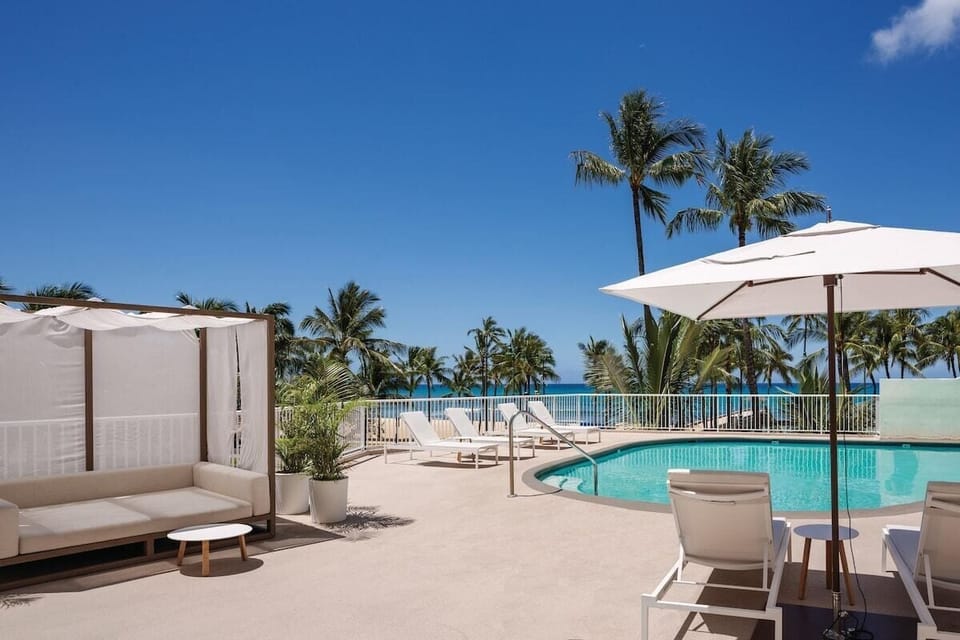 Unwind poolside with ocean breezes and shaded cabana lounging.