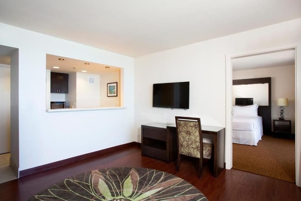 Settle in with an open-plan suite made for easy living.