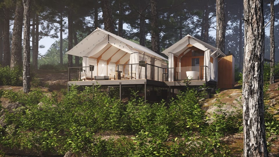 Glamping tent exterior surrounded by serene forest views, perfect for unwinding.