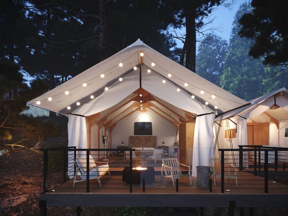 A peaceful glamping tent perched among the trees, offering a perfect escape from the everyday.