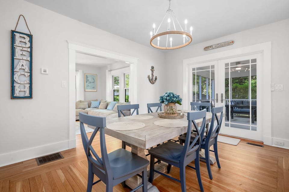 Dining room with seating for six at the table and another four seats at the nearby breakfast bar - 232 Wood Road South Yarmouth Cape Cod - Cape State of Mind -NEVR