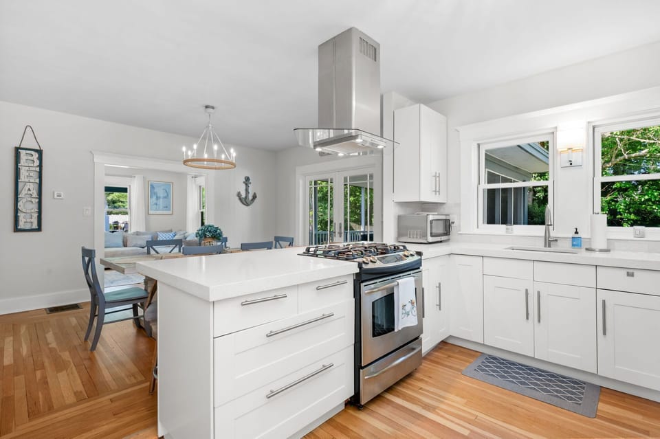 Open floorplan allows the chef to continue the conversation during meal preparation - 232 Wood Road South Yarmouth Cape Cod - Cape State of Mind - NEVR