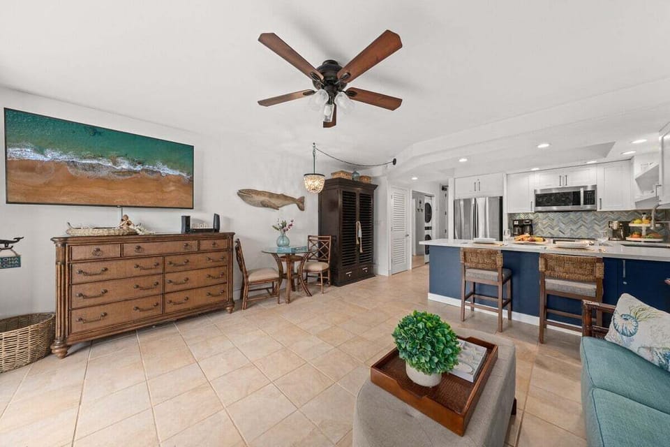 Gather in open living spaces styled with coastal ease.