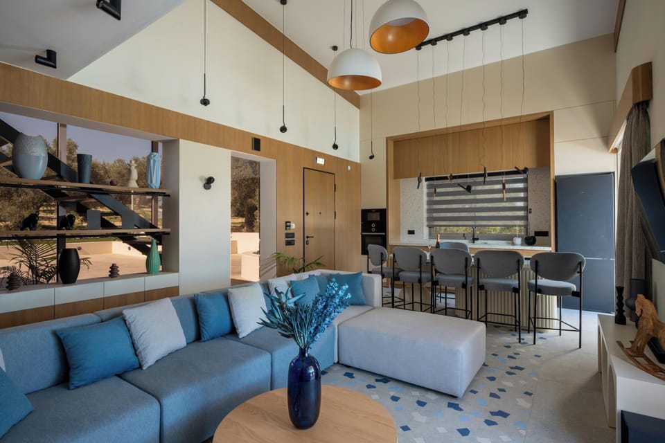 The living room features a 55” TV, a Samsung sound bar, and direct outdoor access