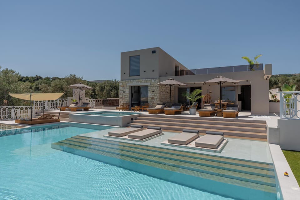 The pool area is equipped with 10 sun beds, side tables, a poolside shower, and 3 umbrellas