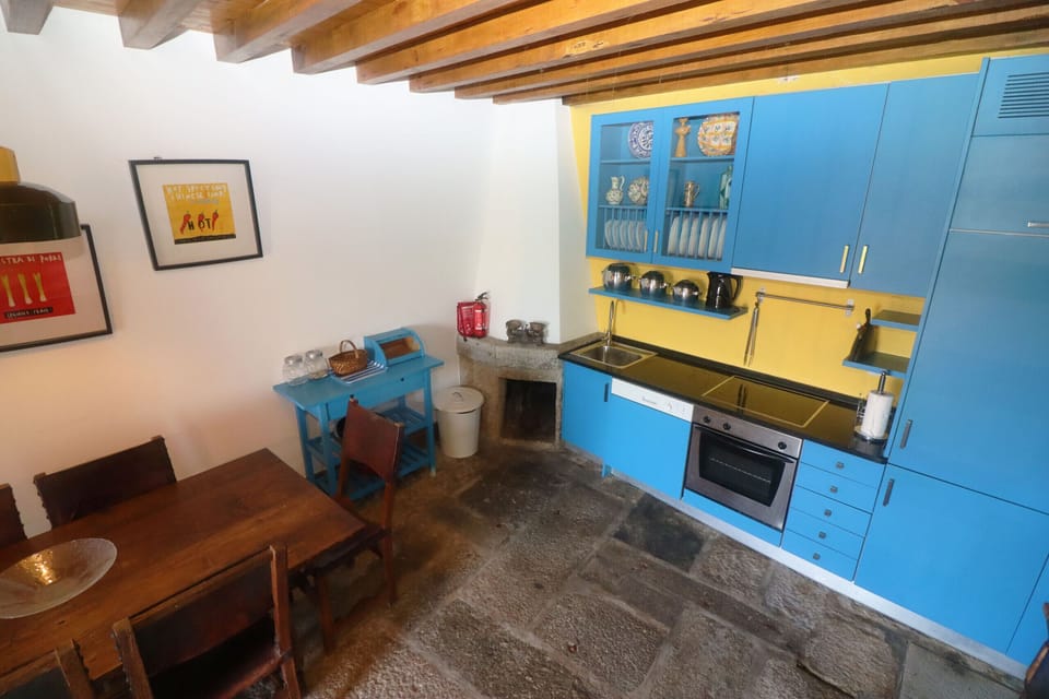 Rustic kitchen equipped in a holiday home in Gerês