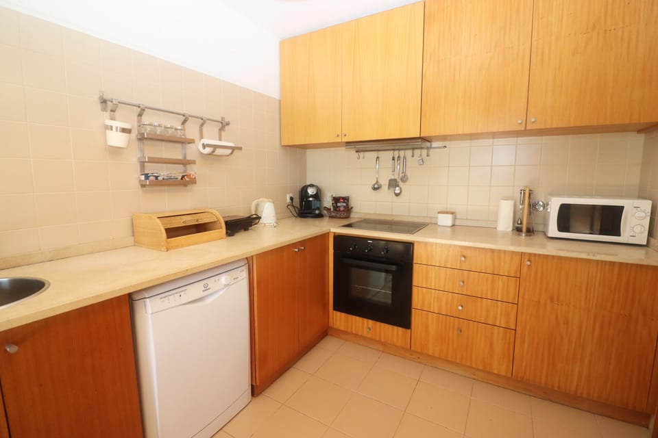 Equipped kitchen in holiday home with private pool
