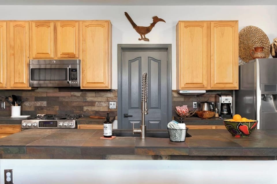 Fully stocked kitchen with ample counter space for snacks or family meals.
