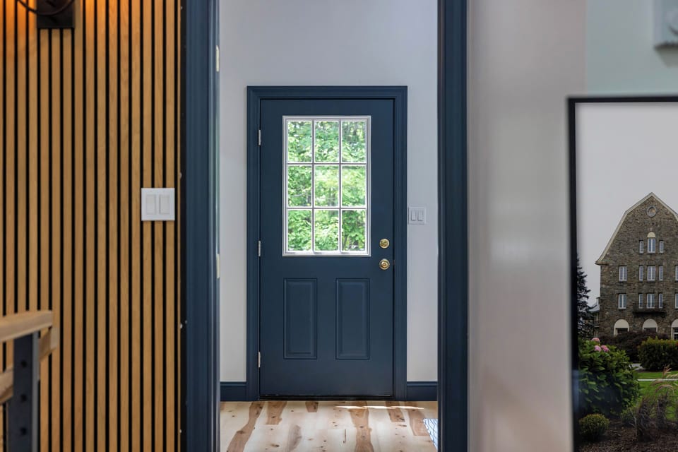 A welcoming entry that blends cozy interiors with nature outside.