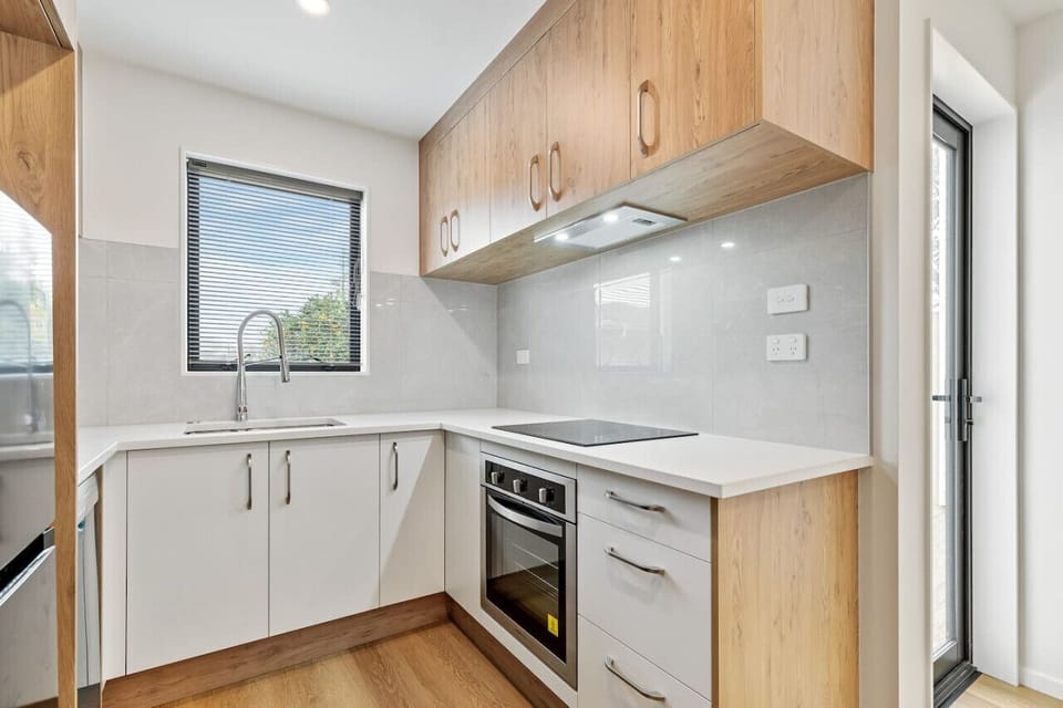 Although compact, the kitchen has a oven, cooktop, dishwasher, microwave and fridge/freezer.