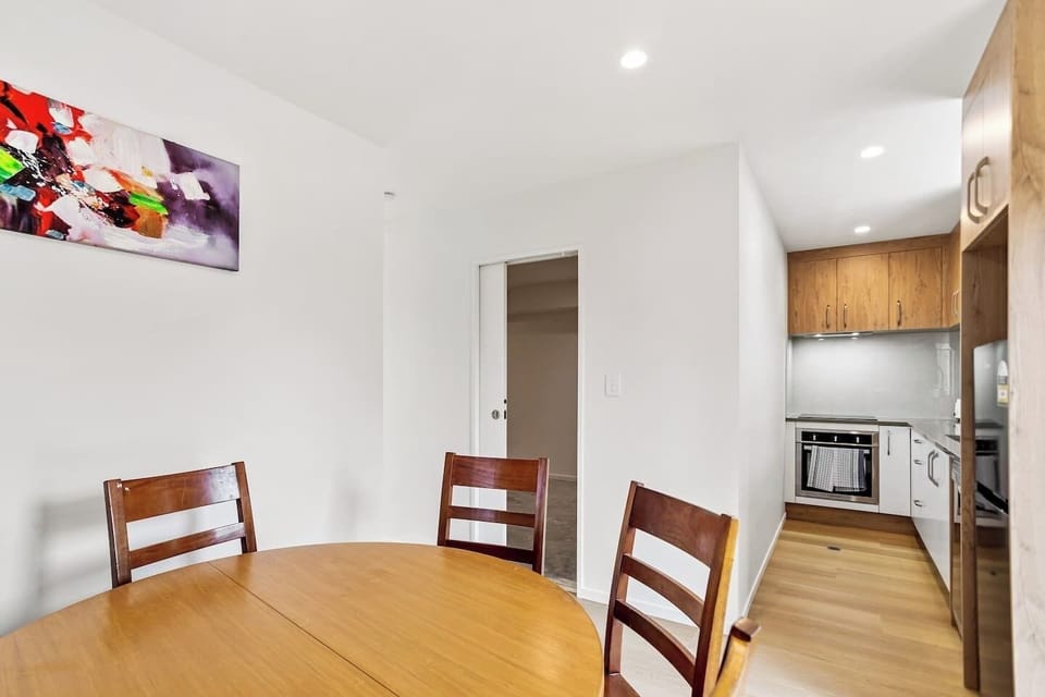 Although compact, the kitchen has a oven, cooktop, dishwasher, microwave and fridge/freezer.
