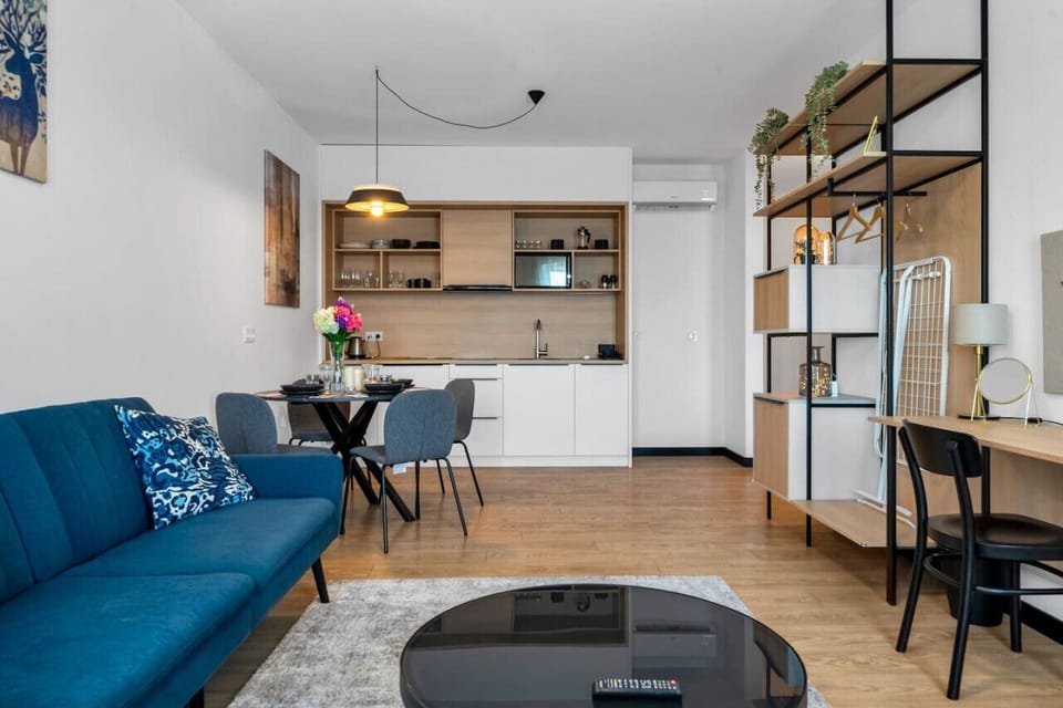 Comfortable Living Room with Sofa Bed and Smart TV | Book Now with RENTUJEMY