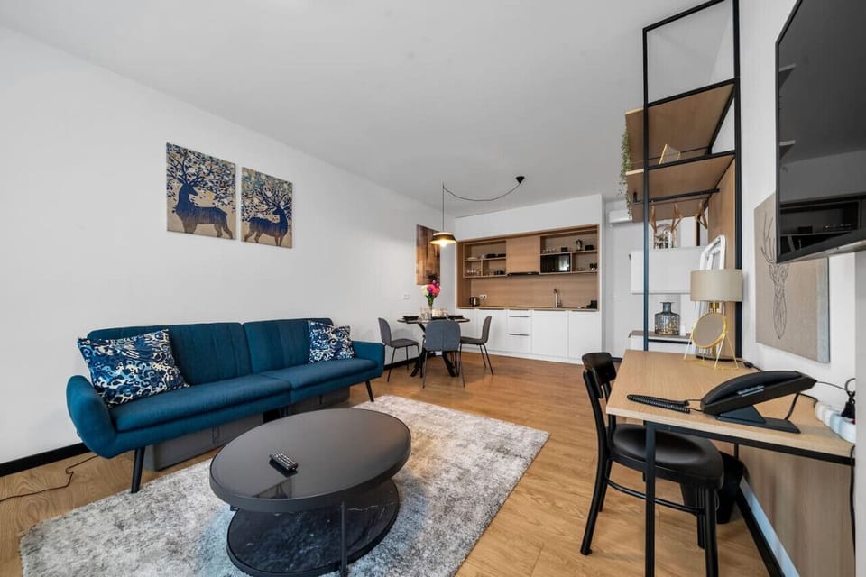 Comfortable Living Room with Sofa Bed and Smart TV | Book Now with RENTUJEMY