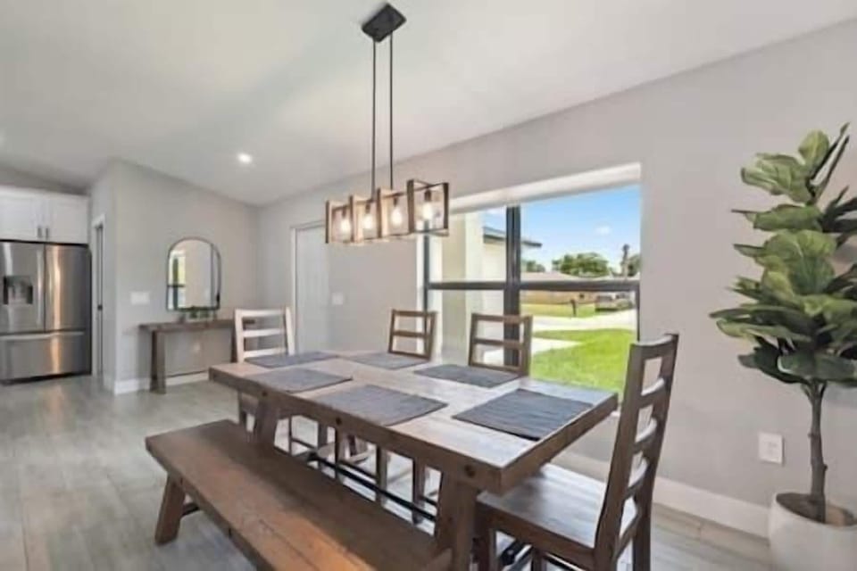 Dining area with 4 chairs and a bench