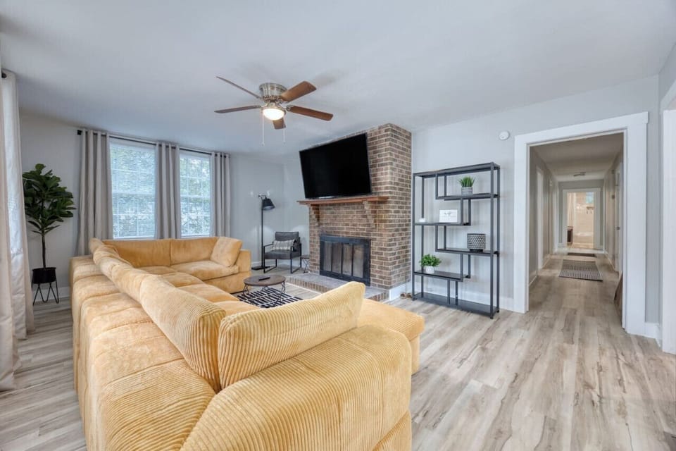 Large sectional for family gathering with 65 inch Smart TV