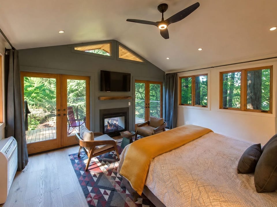 Unwind in a spacious, sunlit bedroom with modern amenities and a cozy atmosphere.